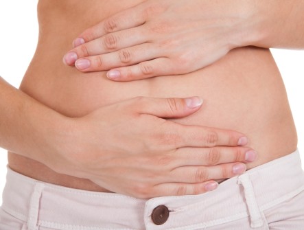 Close up of woman's hands on belly
